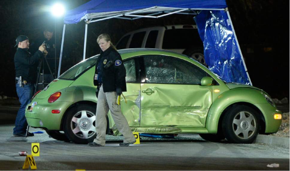 Francisco Kjolseth  |  The Salt Lake Tribune
Multiple bullet holes speckle the side of a VW in the far end of the Walmart parking lot, where a woman was shot and killed on Sunday nigh. The suspect was soon pursued to the nearby Cinemark where he died in a confrontation with police.