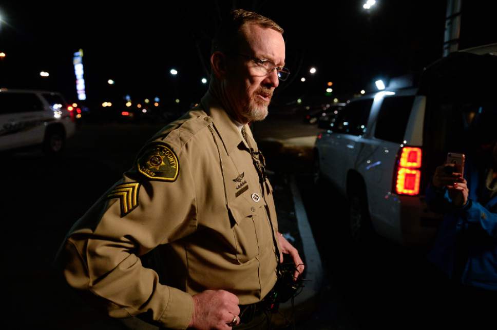 Francisco Kjolseth | The Salt Lake Tribune
Sergeant Spencer Cannon of the Utah County Sheriff's office gives an update at the scene of a fatal shooting near Cinemark in American Fork on Sunday, Dec. 4, 2016. The suspect allegedly fled from a Walmart nearby after shooting and killing a woman in her car.  Following a brief pursuit by police to the Cinemark, officers fired at the suspect when he refused to drop his weapon.