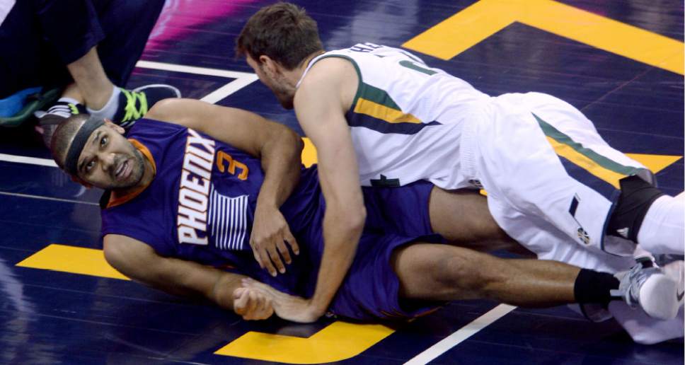 Steve Griffin / The Salt Lake Tribune


Utah Jazz center Jeff Withey (24) and Phoenix Suns forward Jared Dudley (3) crash to the floor during the Utah Jazz versus the Phoenix Suns NBA game at Vivint Smart Home Arena in Salt Lake City Tuesday December 6, 2016.