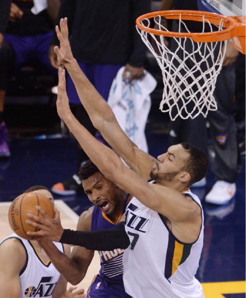 Steve Griffin / The Salt Lake Tribune


Utah Jazz center Rudy Gobert (27) smothers Phoenix Suns guard Leandro Barbosa (19) forcing him to pass during the Utah Jazz versus the Phoenix Suns NBA game at Vivint Smart Home Arena in Salt Lake City Tuesday December 6, 2016.