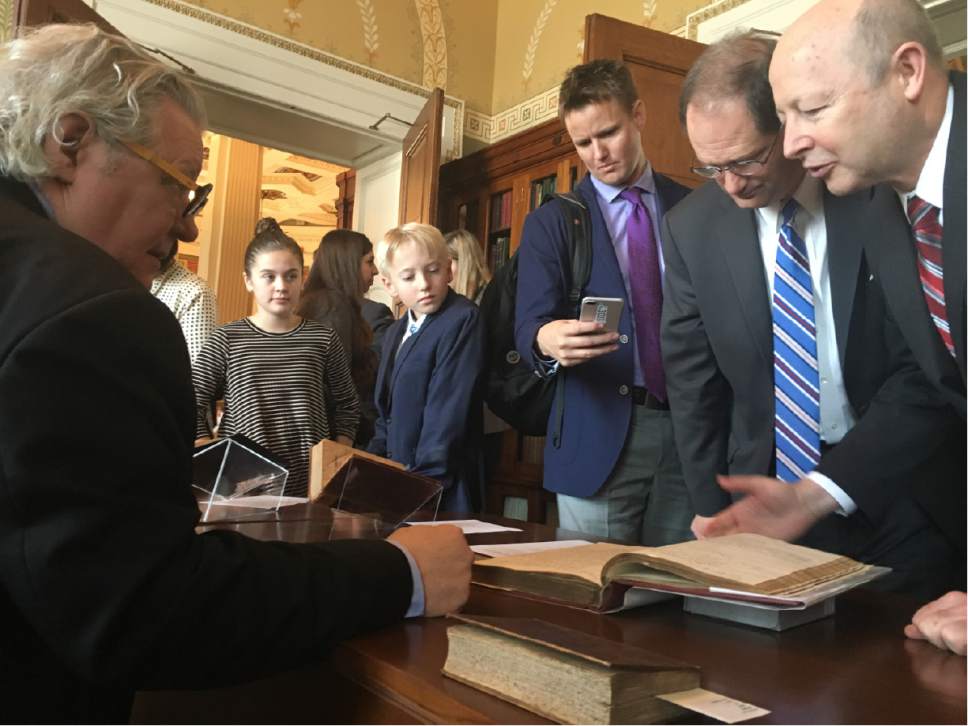 Thomas Burr  |  The Salt Lake Tribune
Mark Dimunation, chief of the Library of Congress' Rare Book and Special Collections Division, talks to visitors about several early copies of the Book of Mormon during an event at the Library of Congress' Jefferson Building on Wednesday, Dec. 7, 2016.