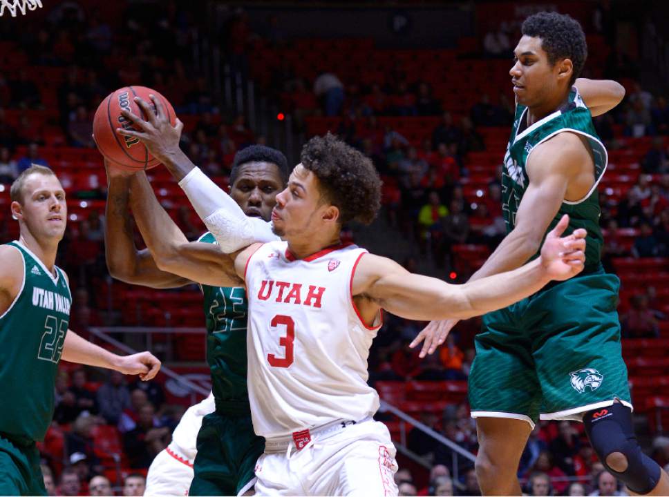 Leah Hogsten  |  The Salt Lake Tribune
Utah Utes guard Devon Daniels (3) tangles with Utah Valley Wolverines forward Isaac Neilson (22) for the rebound. University of Utah leads Utah Valley University 41-36 during their non-conference game Tuesday, December 6, 2016 at the Jon M. Huntsman Center.