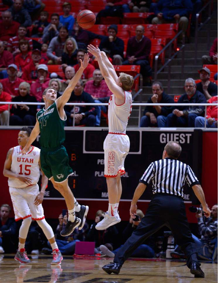 Leah Hogsten  |  The Salt Lake Tribune
Utah Utes guard Parker Van Dyke (5) with a 3-pointer over Utah Valley Wolverines guard Conner Toolson (11). University of Utah defeated Utah Valley University 87-80 during their non-conference game Tuesday, December 6, 2016 at the Jon M. Huntsman Center.