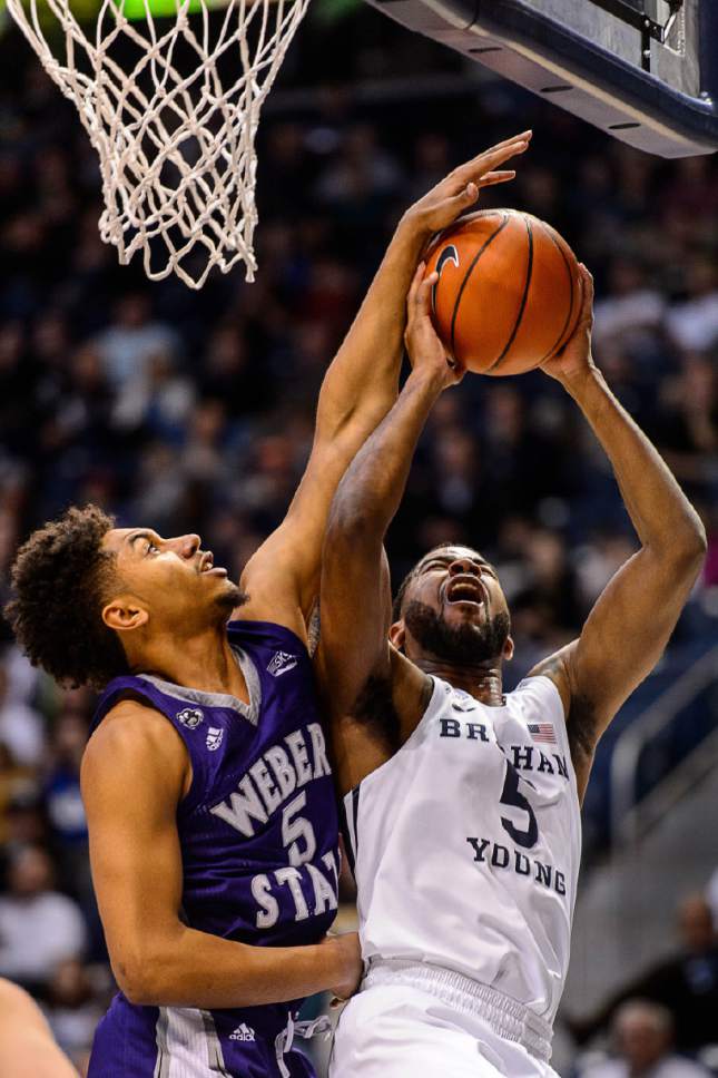 Trent Nelson  |  The Salt Lake Tribune
Brigham Young Cougars guard L.J. Rose (5), defended by Weber State Wildcats guard Cody John (5), as BYU hosts Weber State, NCAA basketball at the Marriott Center in Provo, Wednesday December 7, 2016.