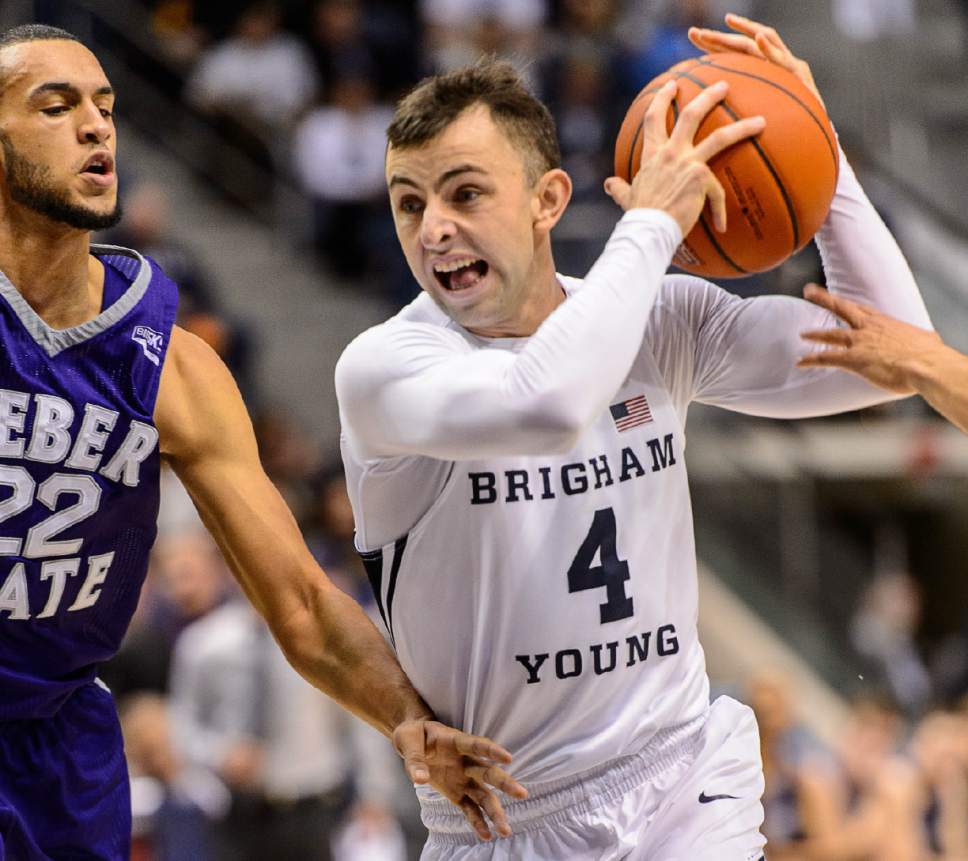 Trent Nelson  |  The Salt Lake Tribune
Brigham Young Cougars guard Nick Emery (4) drives on Weber State Wildcats guard Ryan Richardson (22) as BYU hosts Weber State, NCAA basketball at the Marriott Center in Provo, Wednesday December 7, 2016.