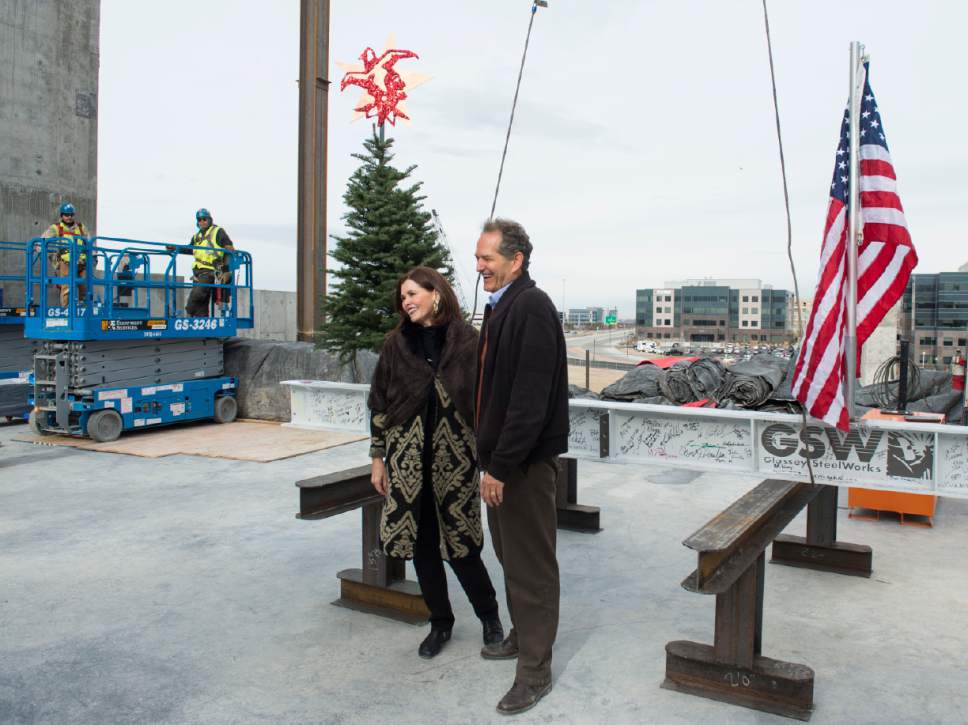 Rick Egan  |  The Salt Lake Tribune

Hale Centre Theatre CEO and Executive Producer, Mark Dietlein, poses for a photo with Vice President and Executive Producer, Sally Dietlein, in front of a 16-foot, 660-pound, signed white beam and an evergreen tree, symbolic of the near completion of the steel structure, in Sandy City, Friday, December 9, 2016.