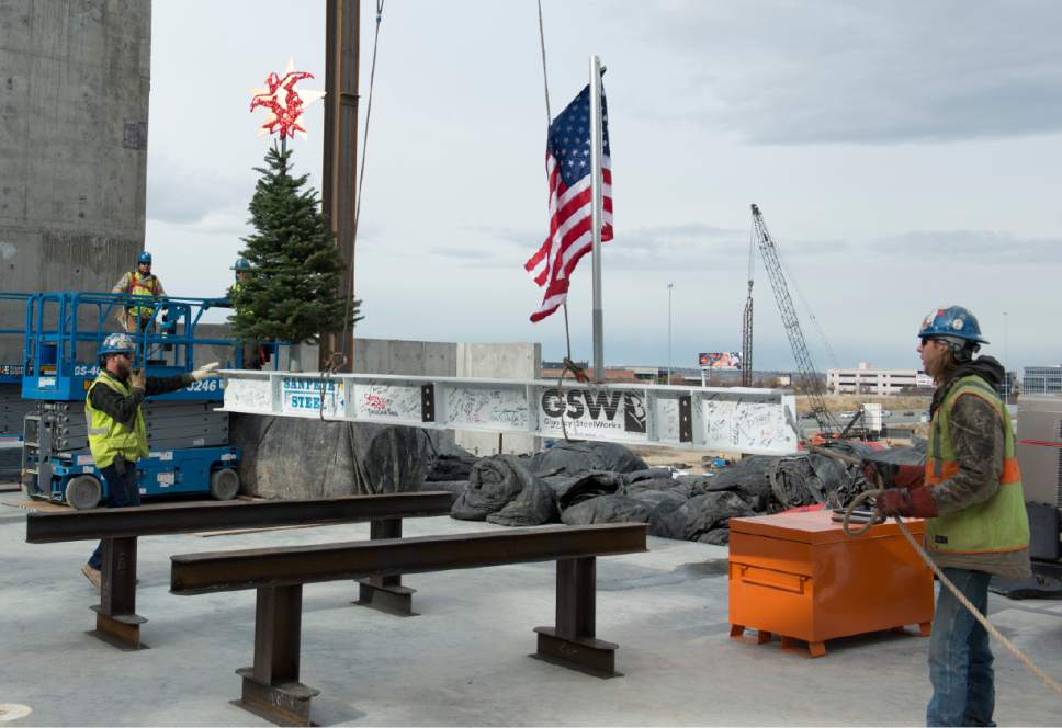 Rick Egan  |  The Salt Lake Tribune

Hale Centre Theatre construction workers raise a 16-foot, 660-pound, signed white beam and an evergreen tree, symbolic of the near completion of the Hale Centre Theatre, in Sandy City, Friday, December 9, 2016.