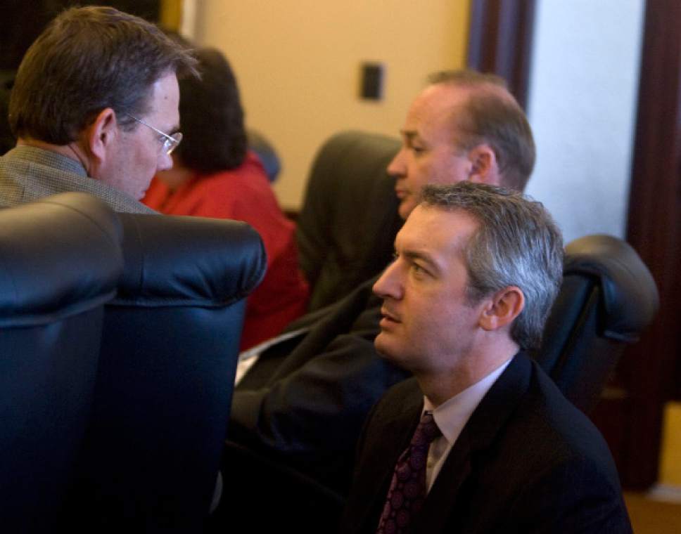 Al Hartmann  |  Salt Lake Tribune

Legislative Fiscal Analyst Jonathan Ball works behind the scenes advising legislators in the Public Education Appropriations Subcommittee on Wednesday January 21, 2009. Rep Bradley Last, left, confers briefly with Ball, right, during the meeting.