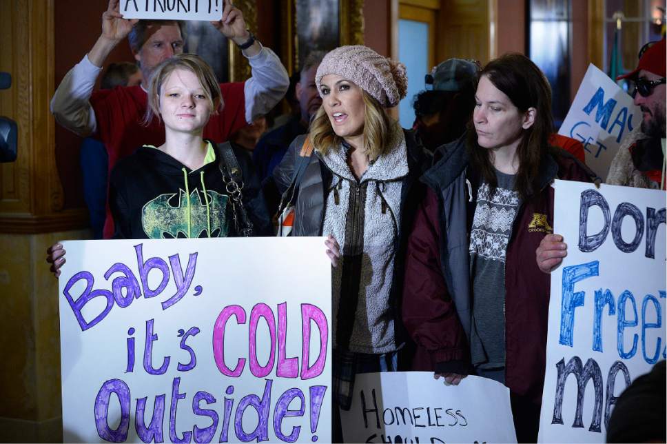 Scott Sommerdorf   |  The Salt Lake Tribune  
Homeless advocate Ashley Hoopes, center, spoke during a demonstration in City Hall outside the office of Mayor Jackie Biskupski. The demonstration was led by former mayor Rocky Anderson, demanding the Mayor produce a plan for emergency overflow shelter space for homeless people, Friday, December 9, 2016. At left is Alixzandra Smallwood, a homeless mother of two, an at right is Kimberly Gross, who is homeless.
