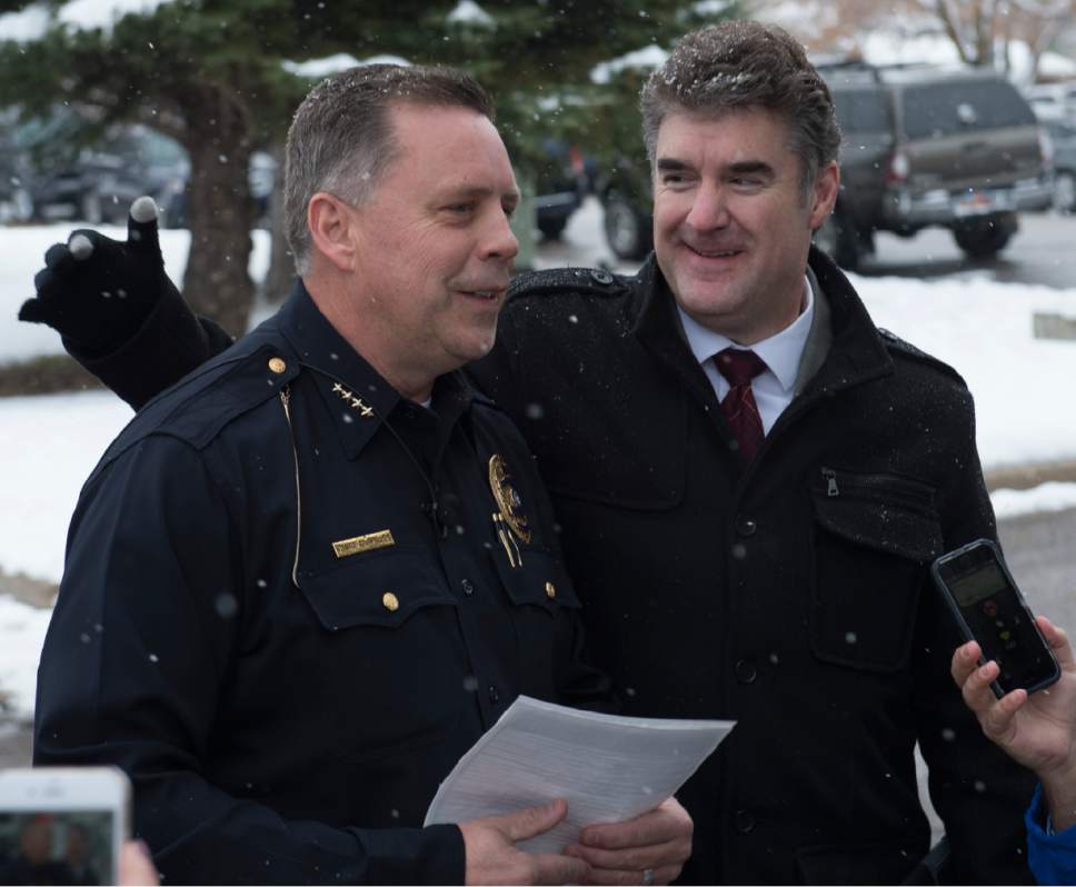 Rick Egan  |  The Salt Lake Tribune

Bountiful Police Chief Tom Ross  gets a pat on the back fro Chris Williams, Davis School District, during a press conference after a shooting at Mueller Park Jr. High, in Bountiful, Thursday, December 1, 2016.