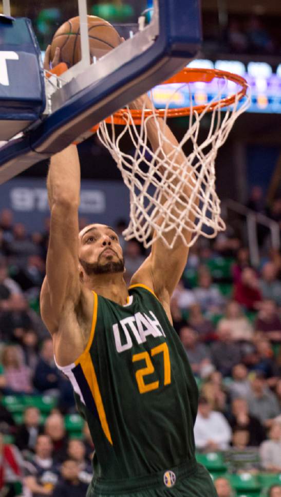 Lennie Mahler  |  The Salt Lake Tribune

Rudy Gobert catches an alley-oop dunk from Boris Diaw in the first half of a game against the Sacramento Kings on Saturday, Dec. 10, 2016, at Vivint Smart Home Arena in Salt Lake City.