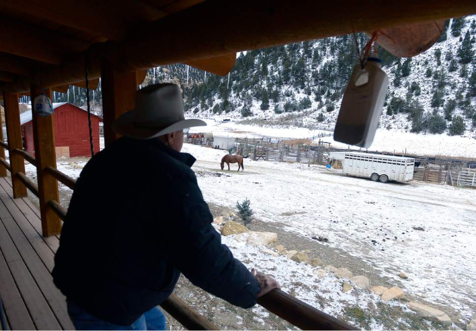 Al Hartmann  |  The Salt Lake Tribune
Bert DeLambert looks from the porch of his solar powered ranch house towards the cattle corrals on his land in Main Canyon in Uintah County Thursday Dec. 8.  His land is immediately below the PR Spring tar sands mine.  His springs have gone dry in the years since U.S. Oil Sands drilled exploratory holes and water wells. 
The DeLambert's unsucessfully tried to block a water rights transfer to U.S. Oil Sands that would allow them to pump more groundwater.