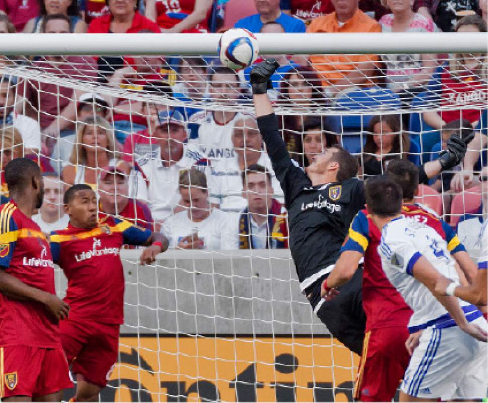 Michael Mangum  |  Special to the Tribune

Real Salt Lake goalkeeper Jeff Attinella (24) tips the ball into the crossbar for a save during the first half of their match against Orlando City FC at Rio Tinto Stadium on Saturday, July 4, 2015.