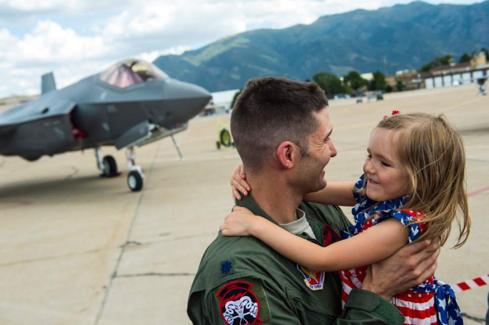 Chris Detrick  |  The Salt Lake Tribune
Lt. Col. Yosef Morris, 34th Fighter Squadron Director of Operations, hugs his daughter Makena, 5, in front of a F-35 at Hill Air Force Base Wednesday September 2, 2015.