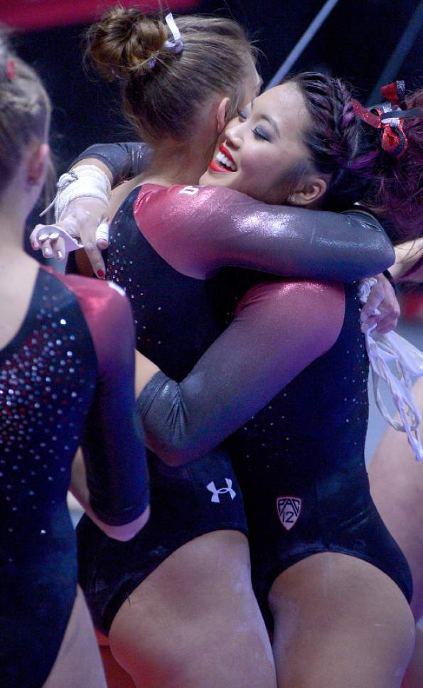 Leah Hogsten  |  The Salt Lake Tribune
Kari Lee is congratulated after her bars routine. University of Utah gymnastics fans got their first glimpse of this year's team at the Red Rocks Preview intrasquad meet at the Huntsman Center, Friday, December 9, 2016.