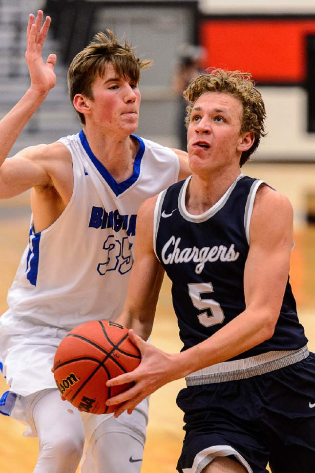 Trent Nelson  |  The Salt Lake Tribune
Corner Canyon's Michael Scheffner, defended by Bingham's Branden Carlson as Bingham faces Corner Canyon in the first round of the Utah Elite 8 boys' basketball tournament at American Fork High, Thursday December 8, 2016.