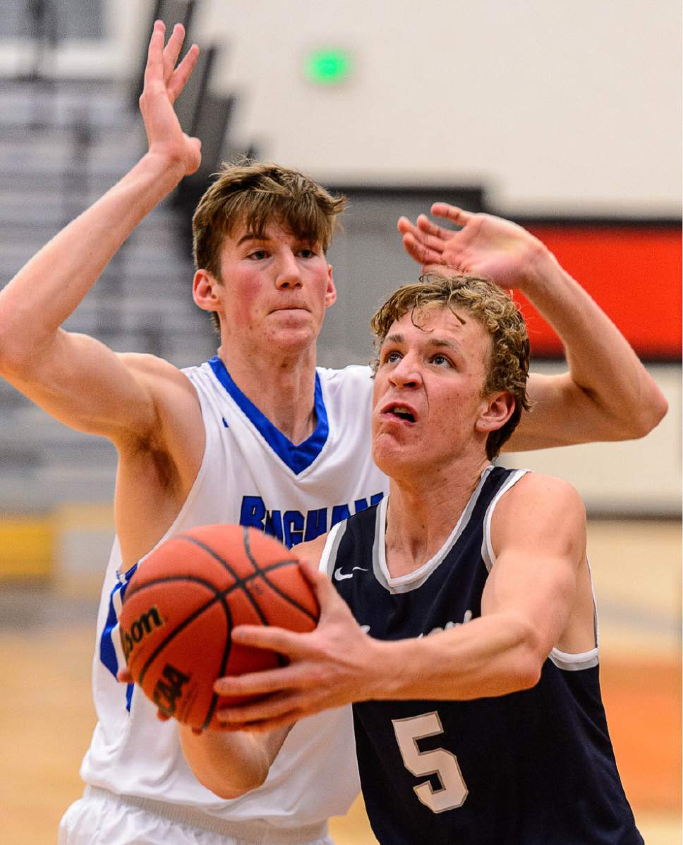 Trent Nelson  |  The Salt Lake Tribune
Corner Canyon's Michael Scheffner, defended by Bingham's Branden Carlson as Bingham faces Corner Canyon in the first round of the Utah Elite 8 boys' basketball tournament at American Fork High, Thursday December 8, 2016.