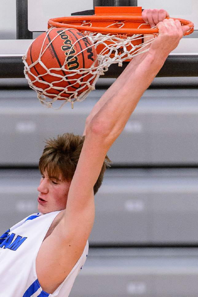 Trent Nelson  |  The Salt Lake Tribune
Bingham's Branden Carlson dunks the ball as Bingham faces Corner Canyon in the first round of the Utah Elite 8 boys' basketball tournament at American Fork High, Thursday December 8, 2016.