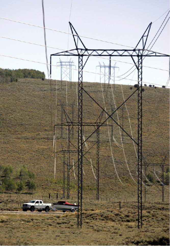 |  Tribune File Photo

High tension power lines cross over highway 96 north of Scofield, Utah,  Sunday, September 14, 2008. Highways 96, 264 and 31 that traverse through Sanpete, Emery and Carbon counties are widely known as the "energy highway".