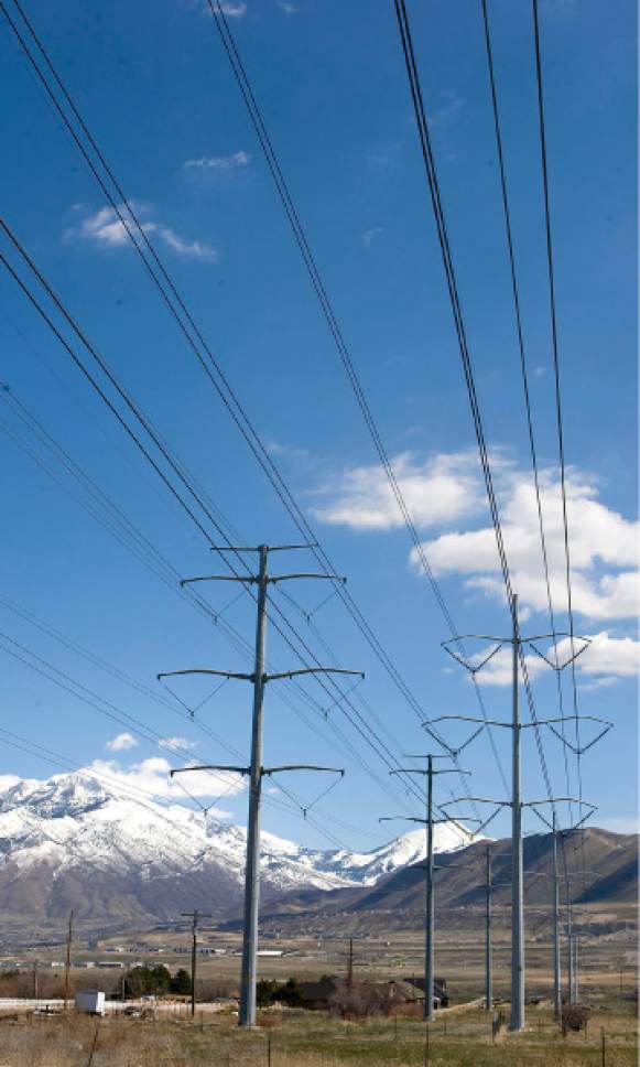 Al Hartmann   |  The Salt Lake Tribune 

View looking East toward Wasatch Mountains of power lines  that cross Redwood Road North of Camp Williams.