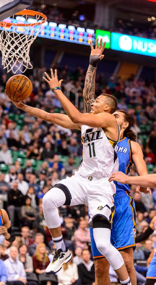 Trent Nelson  |  The Salt Lake Tribune
Utah Jazz guard Dante Exum (11) puts up a shot as the Utah Jazz host the Oklahoma City Thunder, NBA basketball in Salt Lake CityWednesday December 14, 2016.