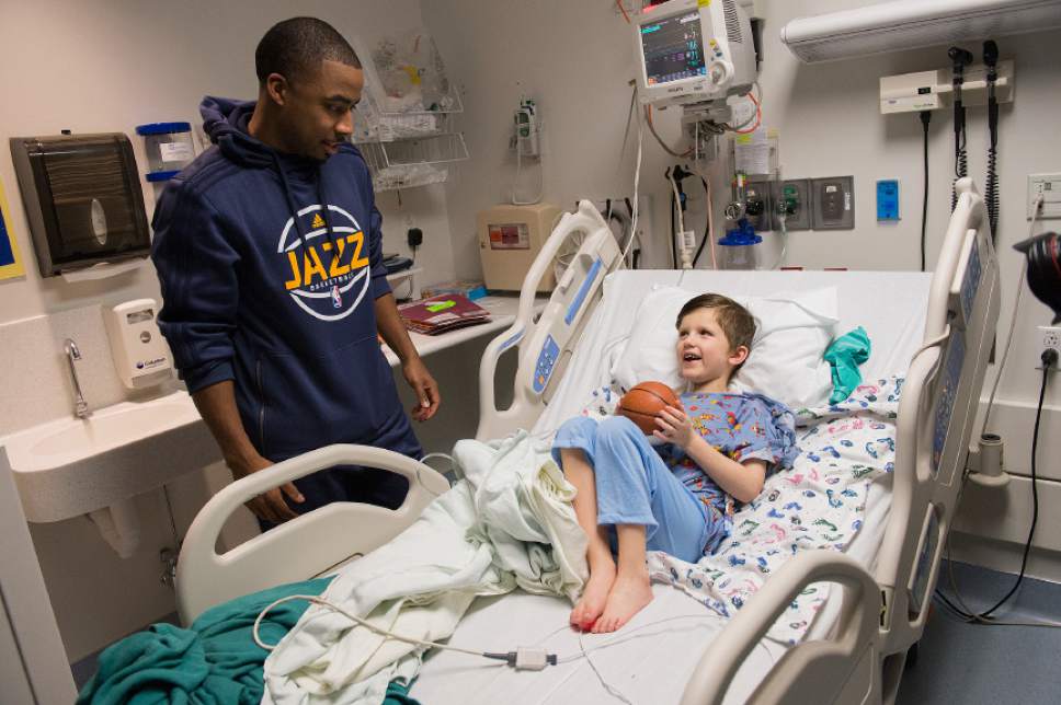 Leah Hogsten  |  The Salt Lake Tribune
Utah Jazz assistant coach Johnnie Bryant visits with Harrison O'Toole, 6, who admitted he styles his hair after Jazz player Gordon Hayward. Players from the Utah Jazz, Salt Lake City Stars players and coaches, Jazz Dancers, Jazz Bear and members of the Wheelin' Jazz  visited Primary Children's Hospital, Thursday, Dec. 15, 2016. The annual Christmas hospital visits are part of the NBA Cares Season of Giving and allow the organization to deliver holiday cheer to patients and their families.