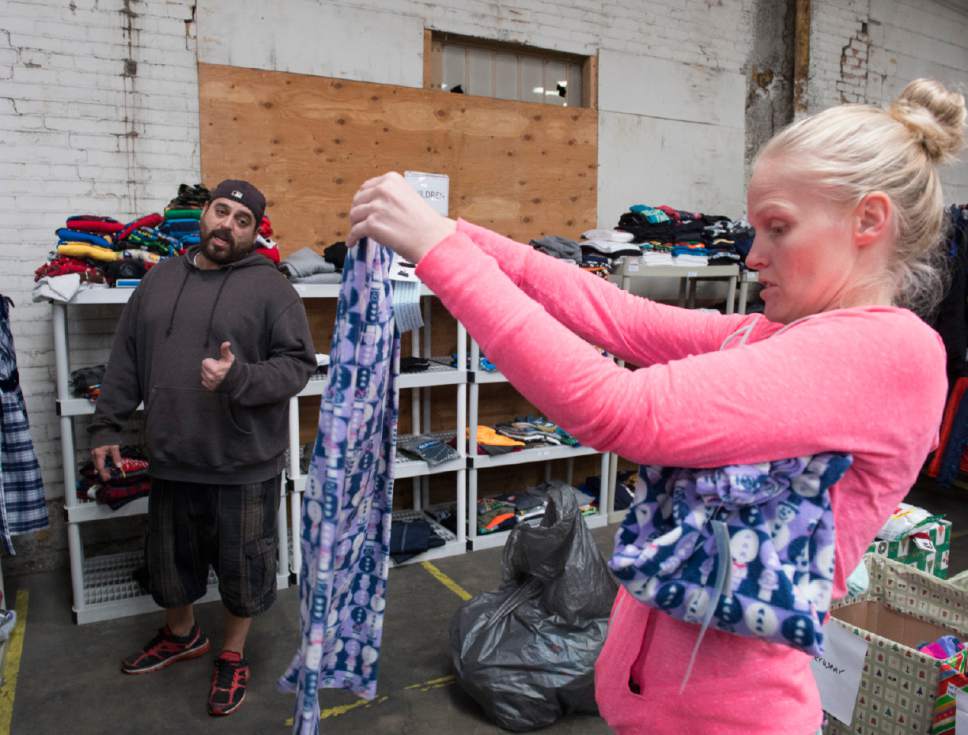 Rick Egan  |  The Salt Lake Tribune

Jerome Regaldo and Desi Jones shop for clothes for their children at the Candy Cane Corner, which gives homeless families an opportunity to shop for Christmas, Friday, December 2, 2016.