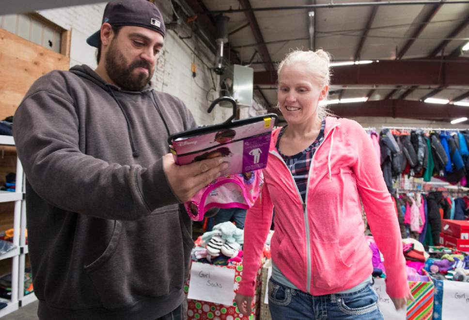 Rick Egan  |  The Salt Lake Tribune

Jerome Regaldo and Desi Jones shop for clothes for their children at the Candy Cane Corner, which gives homeless families an opportunity to shop for Christmas, Friday, December 2, 2016.