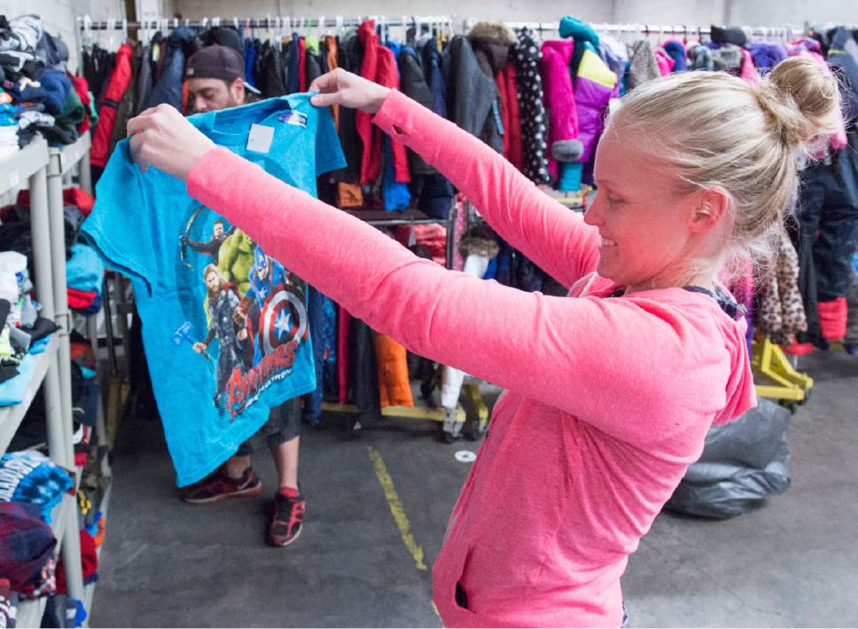 Rick Egan  |  The Salt Lake Tribune

Desi Jones shops for clothes for her children at the Candy Cane Corner, which gives homeless families an opportunity to shop for Christmas, Friday, December 2, 2016.