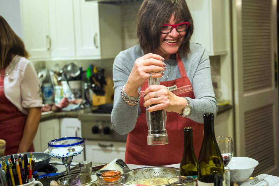 Chris Detrick  |  The Salt Lake Tribune
Cooking instructor Marguerite Henderson makes a tomato and olive tart during a class at her home in Salt Lake City Tuesday December 6, 2016.