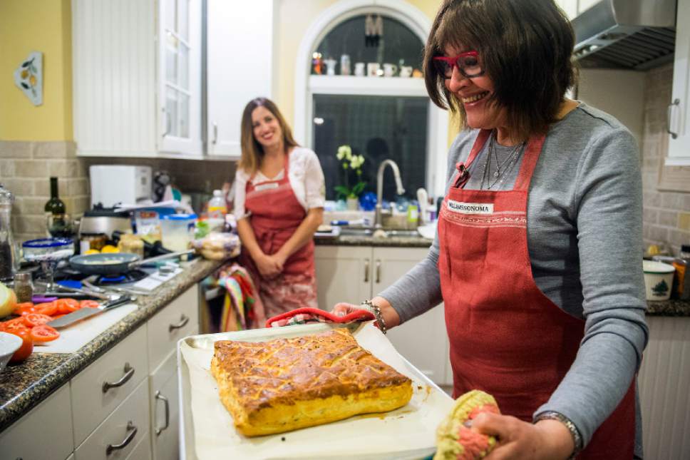 Chris Detrick  |  The Salt Lake Tribune
Cooking instructor Marguerite Henderson pulls out the finished ham and cheese puff pastry during a class at her home in Salt Lake City Tuesday December 6, 2016.