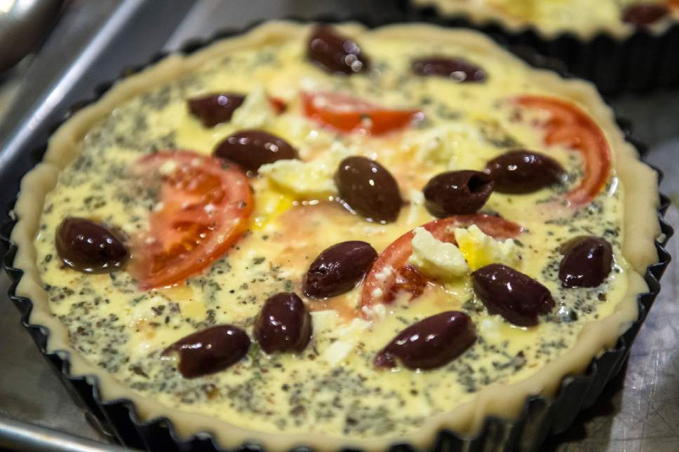 Chris Detrick  |  The Salt Lake Tribune
Cooking instructor Marguerite Henderson makes a tomato and olive tart during a class at her home in Salt Lake City Tuesday December 6, 2016.