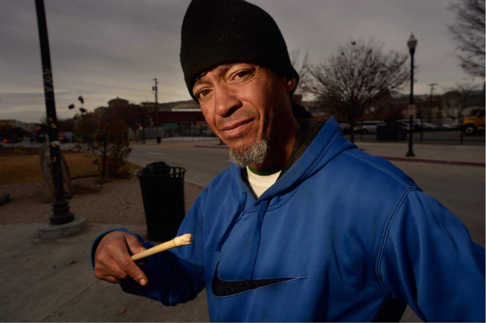 Scott Sommerdorf   |  The Salt Lake Tribune  
Homeless man Nathan Jacobson holds one of his drum sticks as he talks on 500W near the Road Home, Thursday, December 15, 2016.
