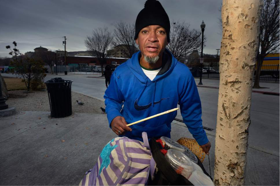 Scott Sommerdorf   |  The Salt Lake Tribune  
Street drummer, and homeless man Nathan Jacobson performs a spontaneous tune on his makeshift drum set  on 500W near the Road Home, Thursday, December 15, 2016.