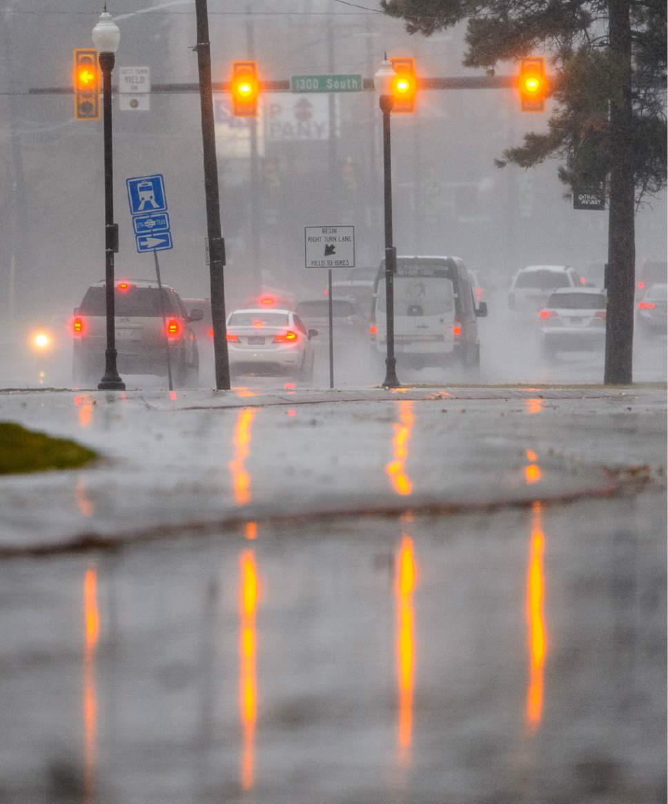 Trent Nelson  |  The Salt Lake Tribune
Traffic moves through the rain along 700 East near Liberty Park in Salt Lake City Friday December 16, 2016.