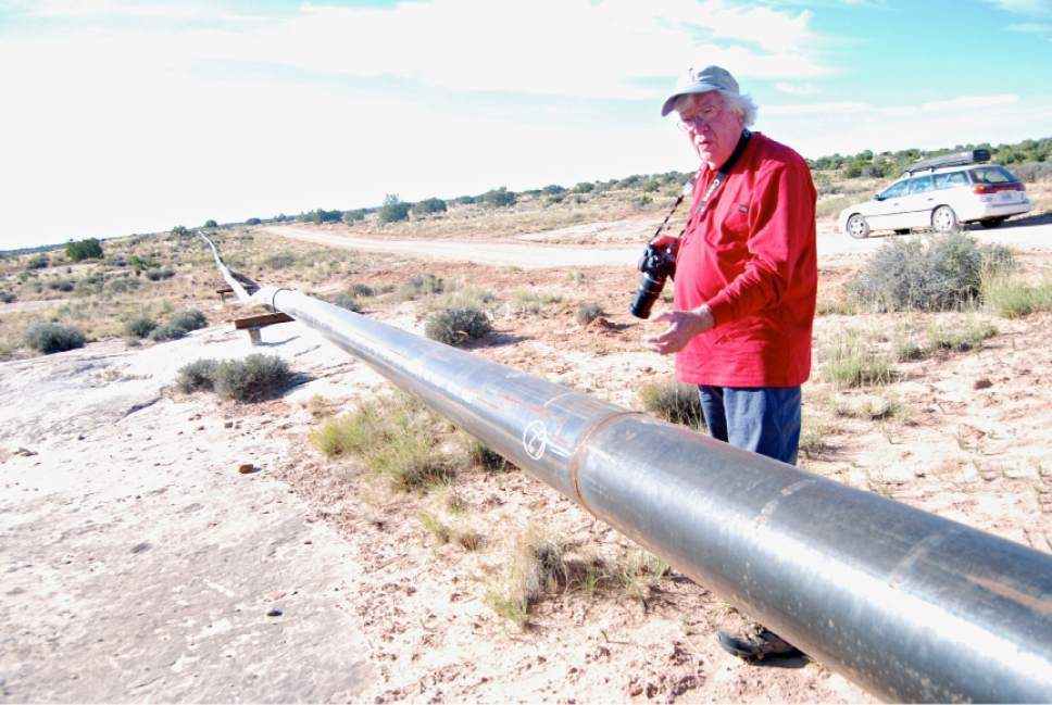 Brian Maffly  |  The Salt Lake Tribune

Bill Rau of Castle Valley describes his concerns about the pipeline network Fidelity Exploration and Production Co. is installing on Big Flat, a scenic recreational area outside Moab. The lines are needed to capture natural gas from the Cane Creek oil field that is currently being flared. This 25-mile lateral line, which well eventually connect to 19 well pads, runs above ground on top of rock and across washes.
