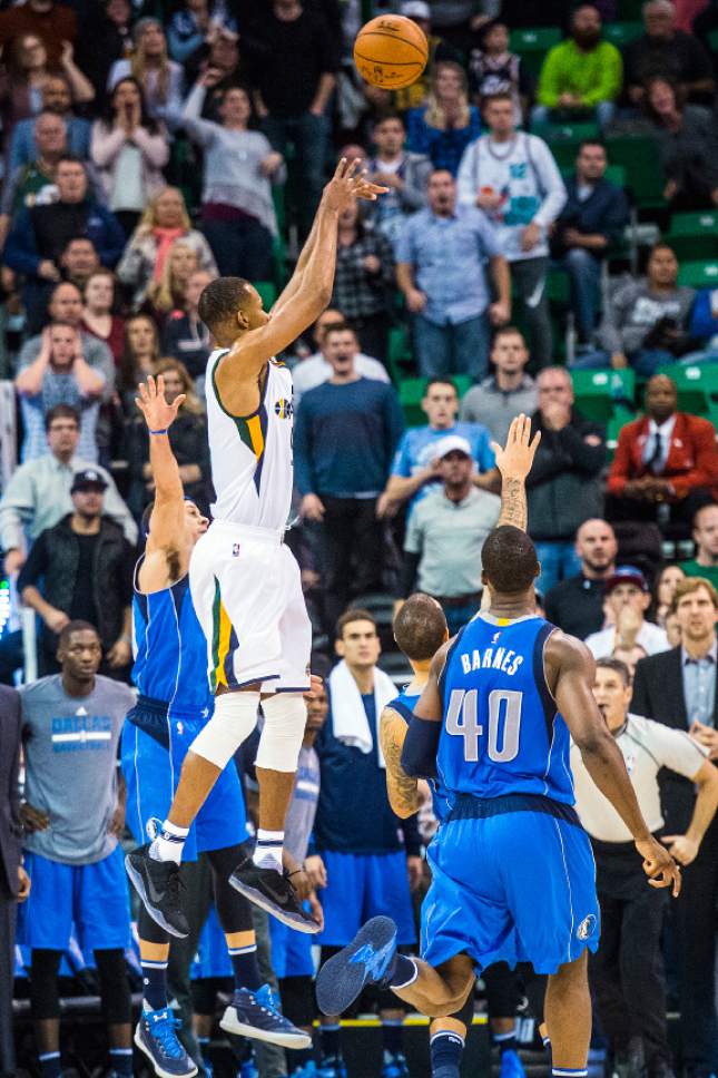 Chris Detrick  |  The Salt Lake Tribune
Utah Jazz guard Rodney Hood (5) shoots the game-winning three-pointer past Dallas Mavericks guard Seth Curry (30) and Dallas Mavericks guard Deron Williams (8) during the game at Vivint Smart Home Arena Saturday December 17, 2016.  Utah Jazz defeated Dallas Mavericks 103-100.