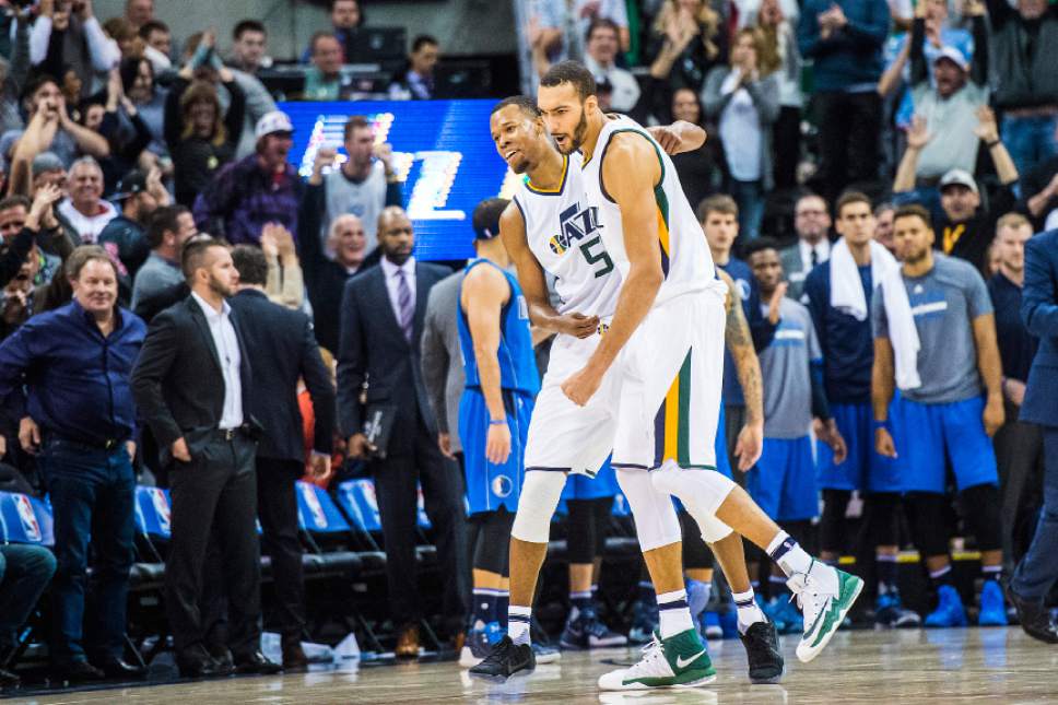 Chris Detrick  |  The Salt Lake Tribune
Utah Jazz guard Rodney Hood (5) celebrates with Utah Jazz center Rudy Gobert (27) after hitting the game-winning three-pointer during the game at Vivint Smart Home Arena Saturday December 17, 2016.  Utah Jazz defeated Dallas Mavericks 103-100.