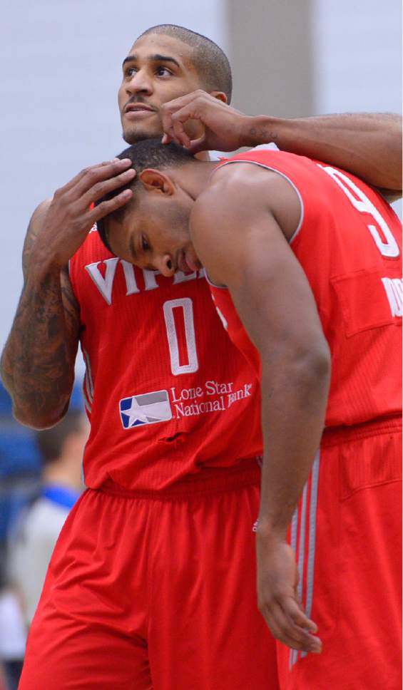 Leah Hogsten  |  The Salt Lake Tribune
Gary Payton II, a former SLCC basketball star, returned to the campus court, Friday, December 16, 2016 with the Rio Grande Valley Vipers basketball team in the NBA's Development League to face the SLC Stars. Gary Payton II and teammate Darius Morris pause for a moment after a play.