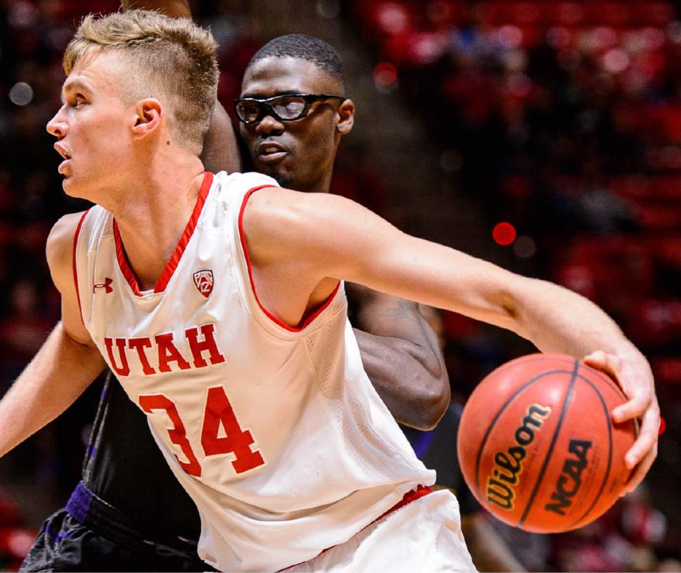 Trent Nelson  |  The Salt Lake Tribune
Utah Utes forward Jayce Johnson (34) drives, with Prairie View A&M Panthers center JD Wallace (12) defending as University of Utah hosts Prairie View A&M, NCAA basketball at the Huntsman Center in Salt Lake City, Saturday December 17, 2016.