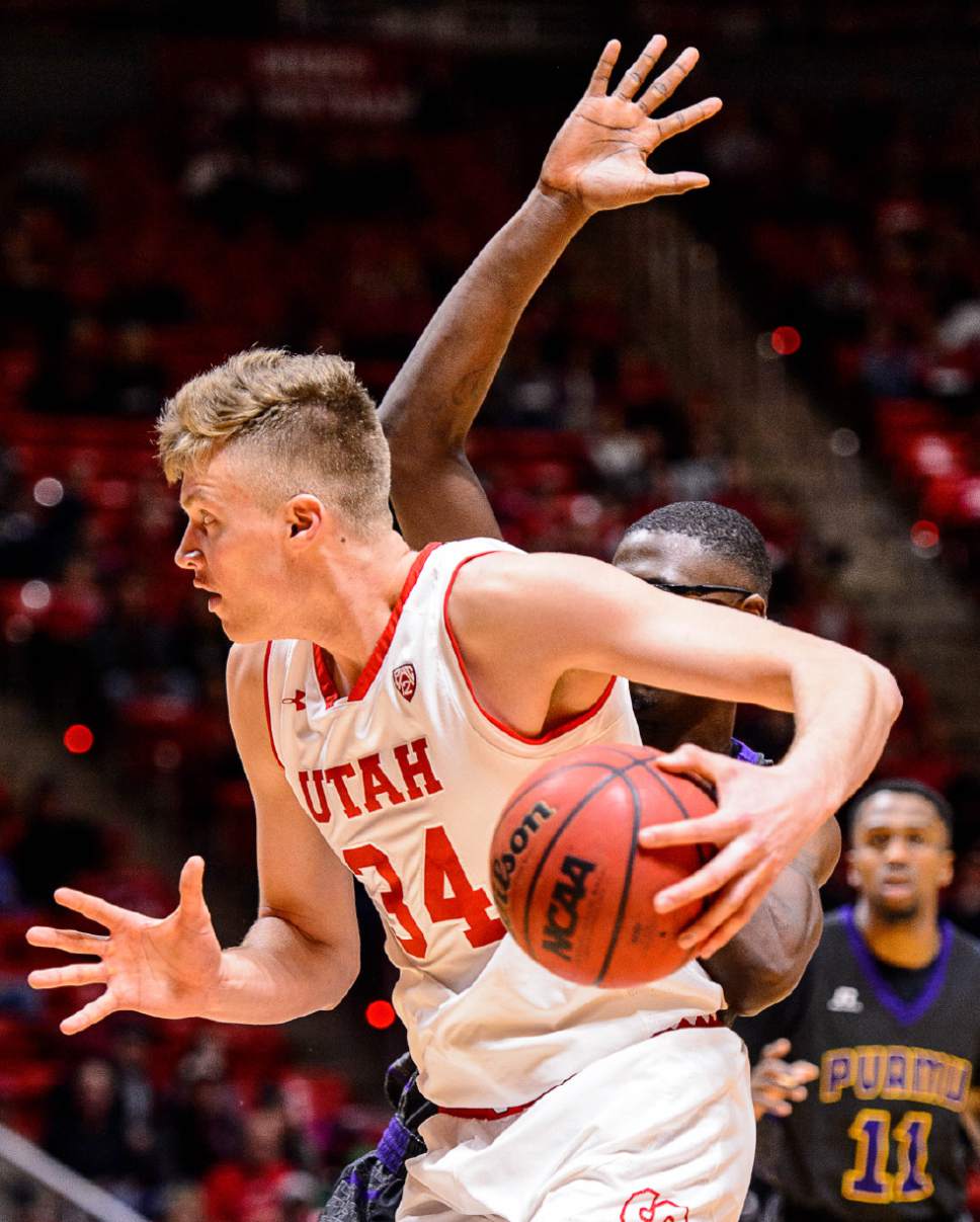 Trent Nelson  |  The Salt Lake Tribune
Utah Utes forward Jayce Johnson (34) drives, with Prairie View A&M Panthers center JD Wallace (12) defending as University of Utah hosts Prairie View A&M, NCAA basketball at the Huntsman Center in Salt Lake City, Saturday December 17, 2016.