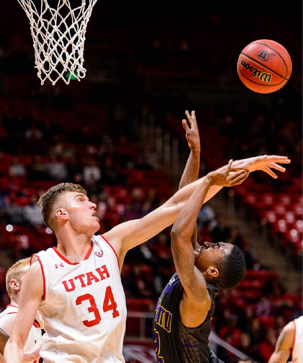 Trent Nelson  |  The Salt Lake Tribune
Utah Utes forward Jayce Johnson (34) blocks a shot by Prairie View A&M Panthers guard Avery Lomax (2) as University of Utah hosts Prairie View A&M, NCAA basketball at the Huntsman Center in Salt Lake City, Saturday December 17, 2016.