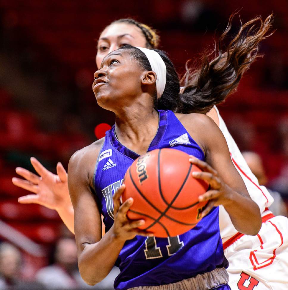 Trent Nelson  |  The Salt Lake Tribune
Weber State Wildcats guard Zharia Hale (11) looks for the shot, with Utah Utes forward Wendy Anae (21) defending, as University of Utah hosts Weber State, NCAA women's basketball at the Huntsman Center in Salt Lake City, Saturday December 17, 2016.
