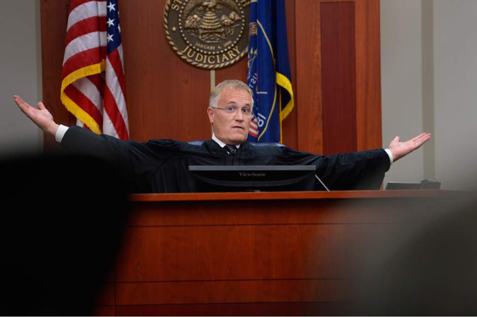 Scott Sommerdorf   |  The Salt Lake Tribune
Third District Juvenile Court Judge James Michie holds out his hands to visually demonstrate how much more serious an added charge of child rape could be if the trial is moved to adult court as he speaks directly to the 15-year-old boy accused of killing Kailey Vijil, Thursday, August 27, 2015.