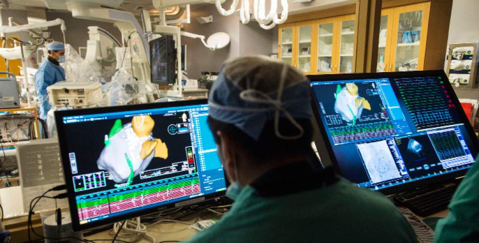 Steve Griffin / The Salt Lake Tribune


Intermountain Medical Center Heart Institute electrophysiologist John Day, MD, left, performs the nationÌs first case using new heart-mapping technology for the treatment of abnormal heart rhythms at the Intermountain Medical Center Heart Institute in in Murray Monday December 19, 2016.  During the procedure, the Intermountain Medical Center team, used St. Jude MedicalÌs EnSite PrecisionTM cardiac mapping system to create 3-D images of the heart.