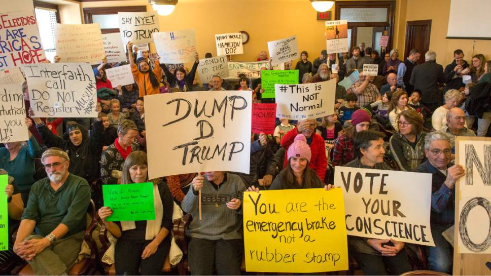 Rick Egan  |  The Salt Lake Tribune

Protestors pack the room at the Utah State Capitol, where Utah's six electors gathered to cast the state's votes in the Electoral College. Each one voting to make President-elect Donald Trump's election official. Monday, December 19, 2016.