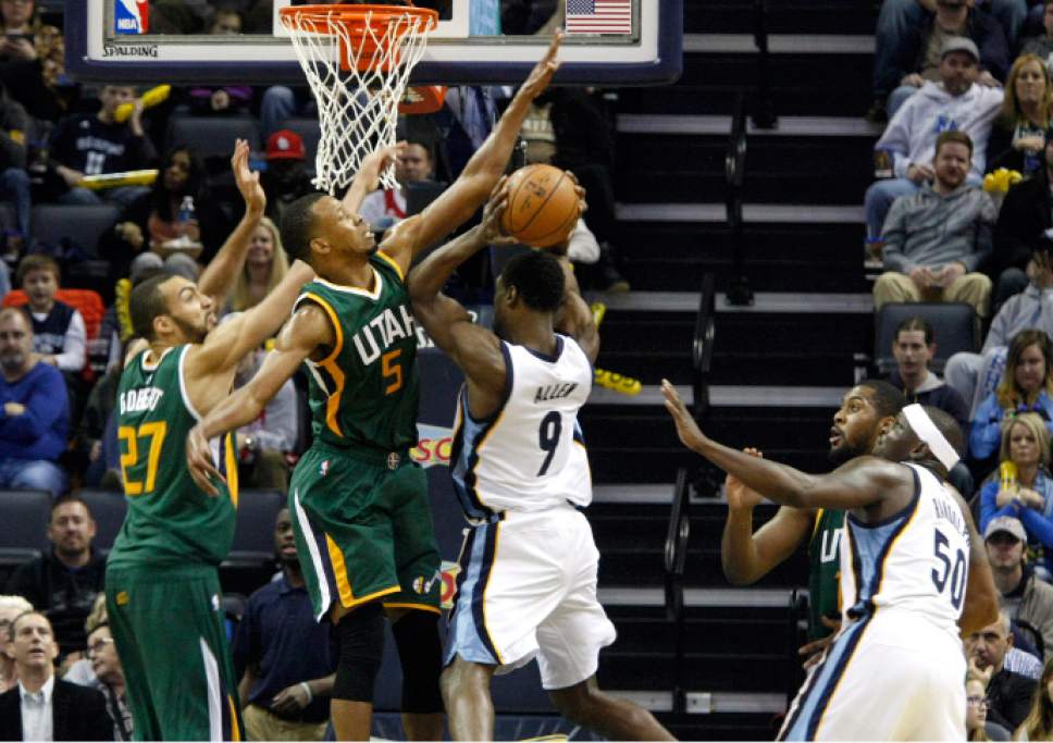 Utah Jazz' Rodney Hood (5) blocks Memphis Grizzlies Tony Allen (9) in the second half of an NBA basketball game Sunday, Dec. 18, 2016, in Memphis, Tenn. (AP Photo/Karen Pulfer Focht)