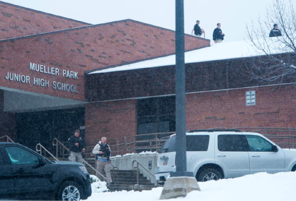 Rick Egan  |  The Salt Lake Tribune

Police officers patrol the roof of  Mueller Park Jr High, after the report of an active shooter in the school, Thursday, December 1, 2016.