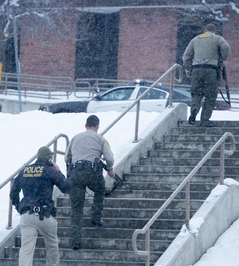 Rick Egan | The Salt Lake Tribune

Police officers enter Mueller Park Jr High around 8:30 A.M. on Thursday, December 1, 2016.