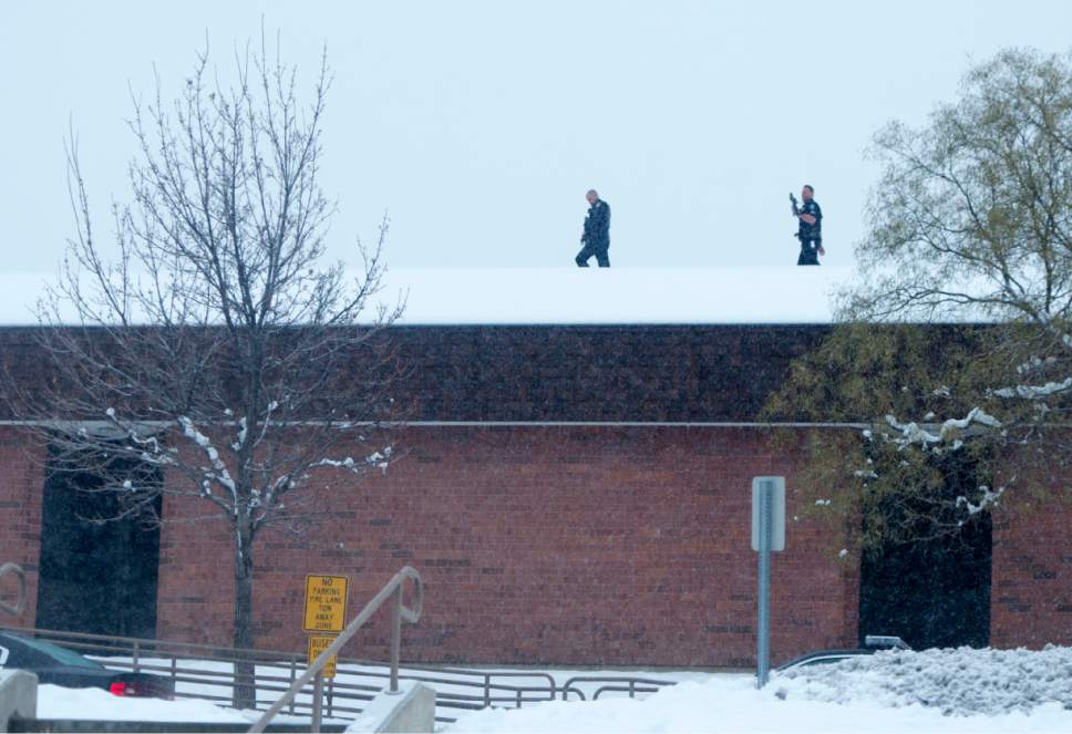 Rick Egan  |  The Salt Lake Tribune

Police officers patrol the roof of  Mueller Park Jr High, after the report of an active shooter in the school, Thursday, December 1, 2016.